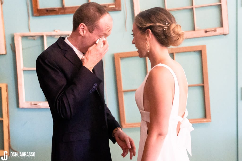 bride and groom first look at Monday Night Garage Wedding