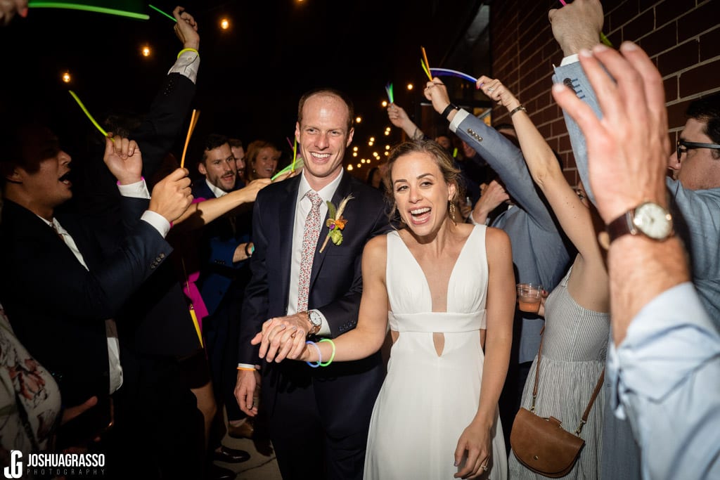 Bride and groom exit at Monday Night Garage Wedding