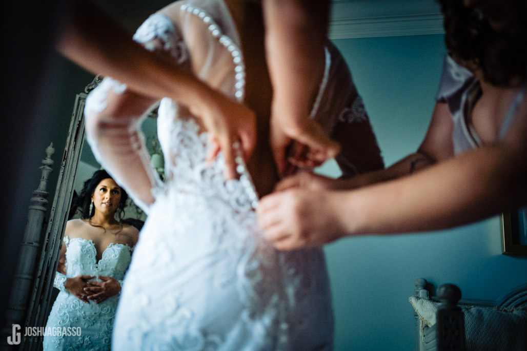 bride getting dressed at the tate house